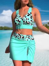 Provain Shop Plus Size Chic Cow Print Bikini Set - Flirty Tie Front Top with Criss Cross Back & Lace-Up Skirt Bottoms - Beach & Poolside Essentials 